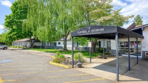 a building with a covered entrance and a sign for Sapphire at Gresham Post Acute Care and Rehabilitation